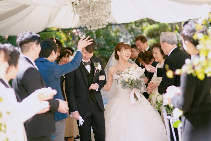 Happy wedding surrounded by flowers.