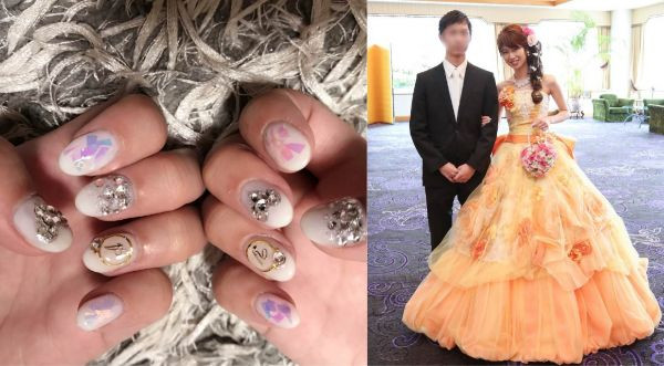 @yuyu.wd07さんのネイルは、薬指の指輪デザインがポイント！それぞれにふたりのイニシャルが入っていて、指輪を通す左手は旦那さんのイニシャルになっているんだとか♡たくさんのお花があしらわれたオレンジのカラードレスと合わせました！