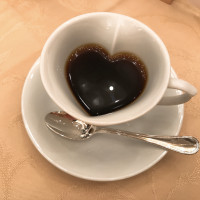 可愛いカップのコーヒー