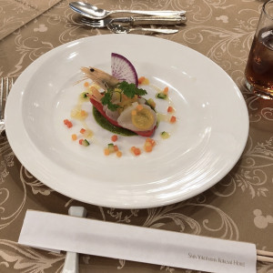 ほたてにパプリカがのっているマリネのようなお料理です。|634670さんの新横浜国際ホテル ウェディング マナーハウス（ウエディング取扱終了）の写真(1584452)