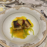 チョリソーを鋳込んだスズキのポワレ　ブイヤベースソース