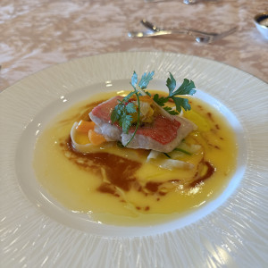 柑橘系のクリームソースがかかった魚料理|770526さんの新横浜グレイスホテル/ ロゼアン シャルムの写真(2534601)